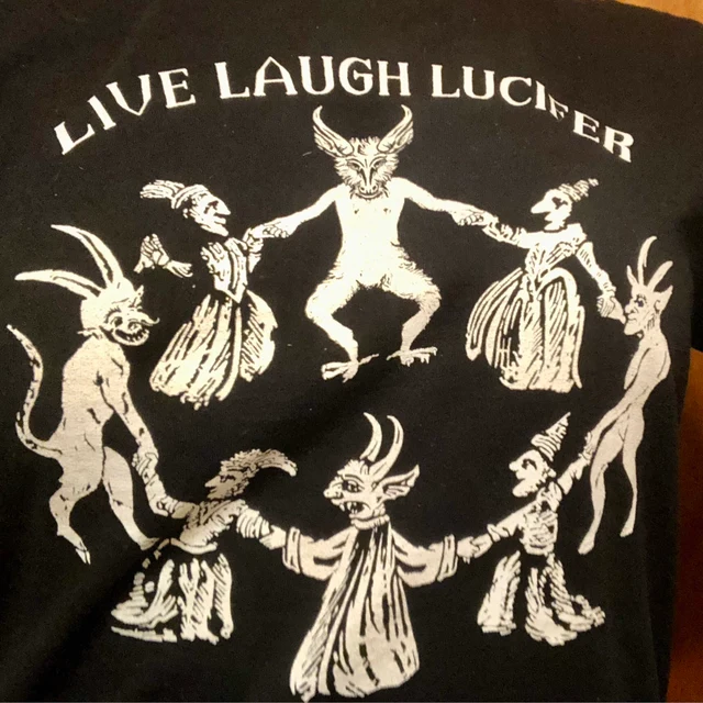 Black t-shirt with white graphic design and 'Live Laugh Lucifer' text on a plain background